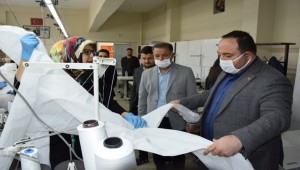 Ekinci tulum ve maske üretim atölyesini ziyaret etti